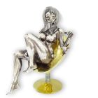 Серебряная статуэтка с позолотой «Девушка в кресле»